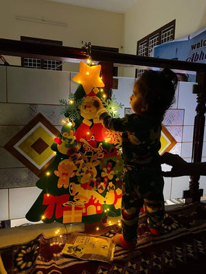 Imaginative holiday play toys for kids with Montessori Christmas tree.