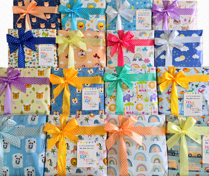 Premium gift wrapping and packaging for kids Montessori toys, books and return gifts with cute printed wrapping paper, polka dot satin ribbon bows, and personalized gift tags. Perfect for baby showers, birthdays and kids party favors